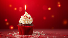 Red Velvet Birthday Cupcake With A Lit Candle