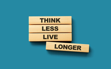 Wooden blocks think less live longer word 3d illustration