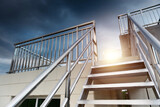 Fototapeta Perspektywa 3d - New metal staircase and handrail on the top of modern building