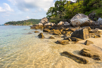 Wall Mural - Famous scenic empty tropical paradise Freedom Beach on Koh Tao island with stones and rocks on shore and in pure crystal water in sunny morning - top travel destinations for vacations in Thailand