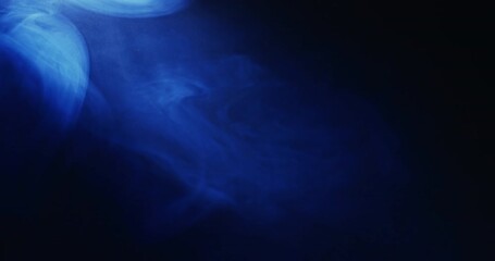 Poster - video of blue clouds of smoke moving with copy space on black background