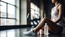 Sport woman sitting and resting after workout or exercise