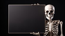 Skeleton Holding Black Empty Card On Black Background Mockup For Halloween Card