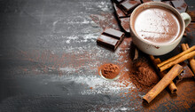 Aromatic Cocoa Drink With Cinnamon And Chocolate. On Black Rustic Background
