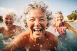Active aging. Energetic group of senior women having a blast in a water aerobics session at an outdoor swimming pool, promoting fun, fitness and longevity in their golden years.