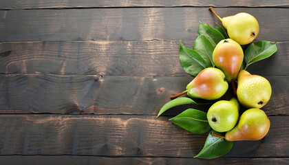 Wall Mural - Fresh pears with leaves. On the wooden background. Free space for text . Top view