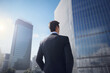 © Ai Studio - Businessman facing tall skyscraper in modern American city.