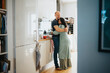 © Johnér - Loving couple hugging in kitchen