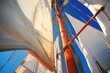 detail of a yachts rigging and sails against blue sky