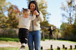 © Johnér - Mother helping daughter to keep balance at playground