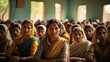 © tilialucida - A group of middle-aged indian women sitting in a room. Community center education group, class.