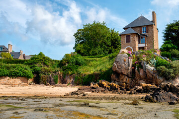 Wall Mural - Country house on red rocks at picturesque Ile de Brehat island in Brittany, in France