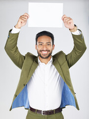 Wall Mural - Happy asian man, portrait and billboard in advertising, marketing or branding against a white studio background. Businessman smile with paper, poster or sign for message or advertisement on mockup