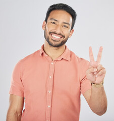 Poster - Peace, hands and portrait of happy man in studio for thank you, vote or feedback on grey background. V, sign and Japanese guy face with good vibes, smile or freedom emoji, support or self love