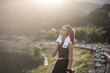 © wichayada - Portrait Young beautiful Asian woman wiping sweat after evening jogging in the park.