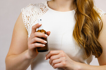 Canvas Print - Woman applying hair cosmetic