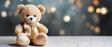 Toy Teddy Bear Sitting On Background With Gold Glitter Bokeh