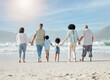© Mumtaaz D/peopleimages.com - Back, beach and family holding hands, walking and summer vacation with bonding, love and travel. People, grandparents and mother with father, children and kids with seaside holiday, ocean and care