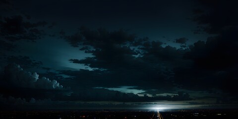 time clouds over the river. black, blue night sky with clouds. dark teal skies background with copy 