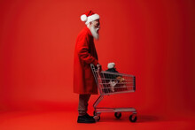 Real Man Santa Claus Near A Shopping Cart Full Of Present Box On A Red Background.  Generative AI.