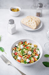 Wall Mural - Spinach cucumber pepper orzo salad in a bowl