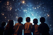 Group of children gazing up at a planetarium ceiling full of stars. 