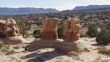 Drone Aerial Wraparound Pair Of Large Rock Formations At Devil's Garden Utah