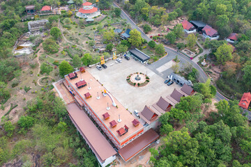 Aerial top view of The Isan pagoda is a buddhist temple near Bangkok, an urban city town, Thailand. Thai architecture landscape background. Tourist attraction landmark.