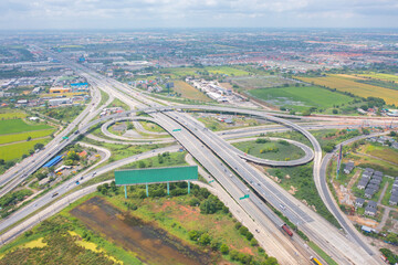 Poster - Aerial view of cars driving on highway junction or moterway. Overpass bridge street roads in connection network of architecture concept. Top view. Urban city, Bangkok, Thailand.