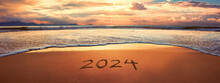 2024 Year Written On Sandy Beach