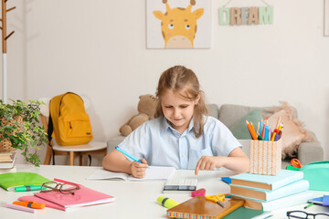 Poster - Cute little girl with calculator doing Math at home