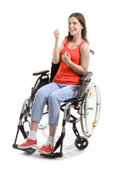 Wall Mural - Happy young woman in wheelchair on white background