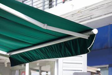 Poster - green awning of shop. green canvas roof.