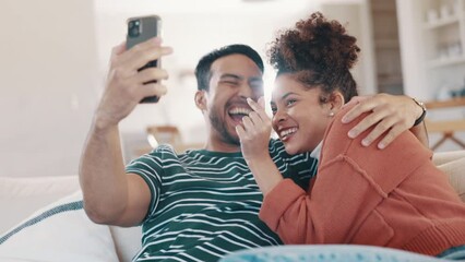 Poster - Couple, selfie and laugh on sofa, home and heart fingers, sign language and icon for post on blog. Man, woman and smile on web, happy memory and profile picture with emoji, social network on couch