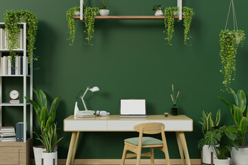 Wall Mural - A modern stylish green home office workspace with a laptop on a table against the green wall