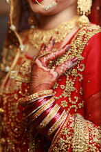 Bride Showing Hands Applied Henna , Decorative Hands, Bangles Red Dress Mehndi, Rings And Jewelry , Indian Pakistani Bride