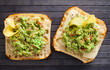 Fried slices of square bread with warm cheese and homemade guacamole on the table