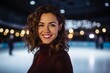 Portrait of smiling woman skating on ice rink at rink in winter