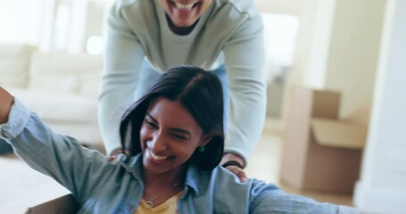 Poster - Moving, boxes and man push woman for fun, playing and bonding together in their new house. Happy, smile and young boyfriend being playful with his girlfriend for freedom or game in their apartment.