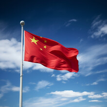 China Flag Against Blue Sky