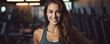 © Michal - Attractive woman smiling in gym background. wide banner