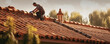 © Michal - Tile roofer on house. Man repair roof from leaking water.