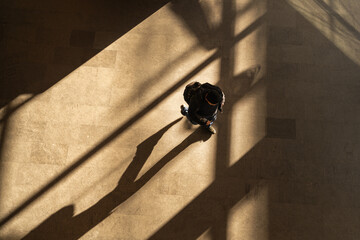 Wall Mural - top aerial view tourist people walk across pedestrian concrete. a traveler walking with a suitcase at the airport. concept of social still life.