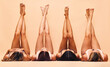 © Anela/peopleimages.com - Diversity, skincare and legs of women in studio for beauty, comparison or wellness on wall background. Difference, beauty and female friends relax in a line with feet up for glowing skin or treatment