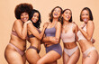 © Anela/peopleimages.com - Body positive, self love and portrait of women in studio in underwear for wellness, beauty and diversity. Lingerie campaign, natural and people on brown background for pride, skincare and inclusion