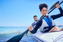 Water, Man And Woman In Kayak At Ocean For Race At Lake, Beach Or River, Exercise In Sport. Holiday, Adventure And Fitness, Couple Rowing In Canoe For Training Or Challenge, Mockup On Blue Sky At Sea
