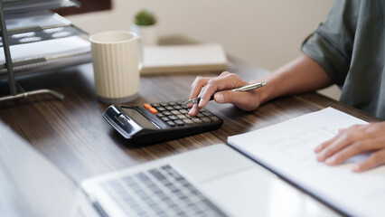 Wall Mural - Female calculating personal financial for future plan at her home, taxes payment..