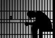 © Daken Design - silhouette of a prisoner behind bars