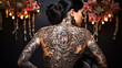Tattoo of a flower on the back of a sensual woman with a black bun