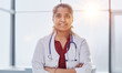 © Katsiaryna - Confident female doctor with his arms crossed